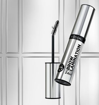 A silver L'Oréal Brow Lamination product tube and wand floating against a light grey wall background with elegant white architectural molding.