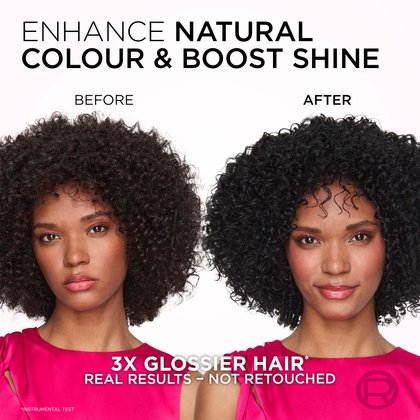 A split image showing a woman with dark, curly hair before and after a hair treatment. On the left, labeled "AVANT" (BEFORE), her hair appears a natural, slightly less vibrant dark brown or black. On the right, labeled "APRÈS" (AFTER), her hair is noticeably glossier, a richer black, and her curls appear more defined, with her face showing a subtle smile. Text above the images reads: "REHAUSSE LA COULEUR NATURELLE ET AUGMENTE LA BRILLANCE" (ENHANCES NATURAL COLOR AND INCREASES SHINE). Below the images, more text states: "DES CHEVEUX 3X PLUS BRILLANTS*" (3X SHINIER HAIR*) and "RÉSULTATS RÉELS - NON RETOUCHÉS" (REAL RESULTS - UNRETOUCHED), with a small asterisk indicating "*TEST INSTRUMENTAL" (INSTRUMENTAL TEST). The woman is wearing a vibrant pink top.