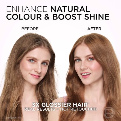A split image featuring a woman with long, wavy blonde hair. The left side, labeled 'BEFORE,' shows her hair with its natural texture and a more subdued shine. The right side, labeled 'AFTER,' displays the same woman with significantly shinier, smoother, and more vibrant dark blonde hair, demonstrating enhanced natural color and boosted shine. Text overlays include "ENHANCE NATURAL COLOUR & BOOST SHINE", "3X GLOSSIER HAIR", and "REAL RESULTS – NOT RETOUCHED".