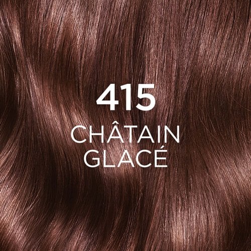 Gros plan sur une mèche de cheveux longs et ondulés colorés avec la nuance "415 CHÂTAIN GLACÉ". La couleur est un marron riche avec des reflets subtils, suggérant une teinte glacée. Le chiffre "415" est affiché en grand et en blanc au centre de l'image.
