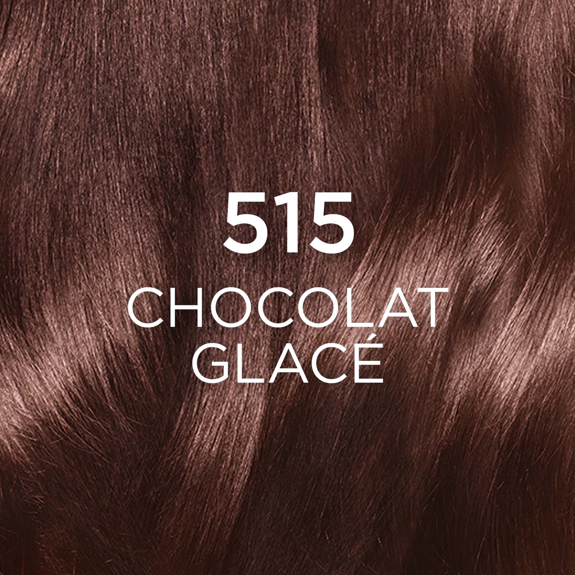 Gros plan sur une mèche de cheveux bouclés, d'une couleur "600 CHÂTAIN CLAIR". La teinte est un marron clair et lumineux, évoquant une nuance naturelle et douce. Le chiffre "600" est affiché en grand et en blanc au centre de l'image.