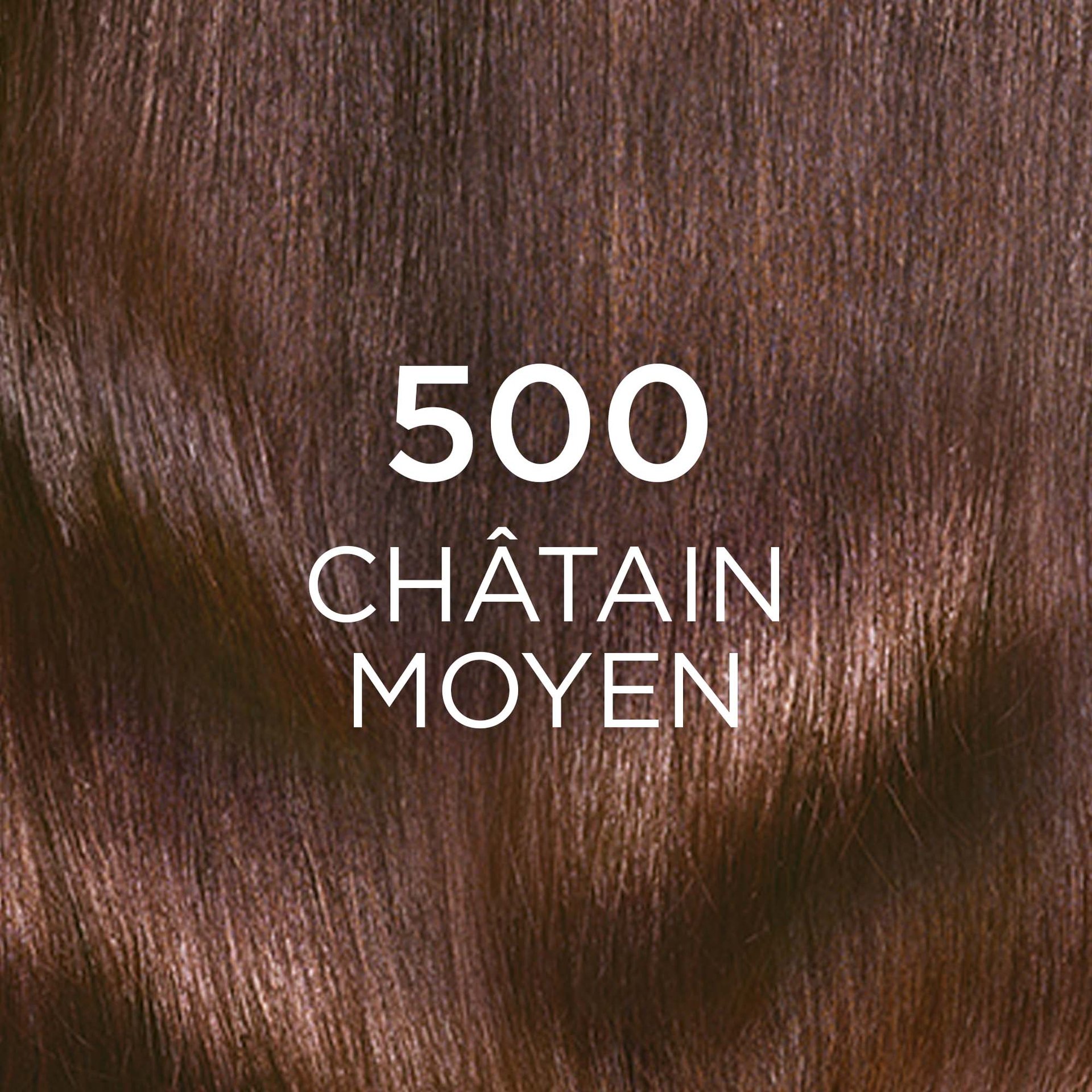 Gros plan sur une mèche de cheveux longs et ondulés colorés avec la nuance "500 CHÂTAIN MOYEN". La couleur est un marron profond et naturel, évoquant une teinte châtain classique. Le chiffre "500" est affiché en grand et en blanc au centre de l'image.