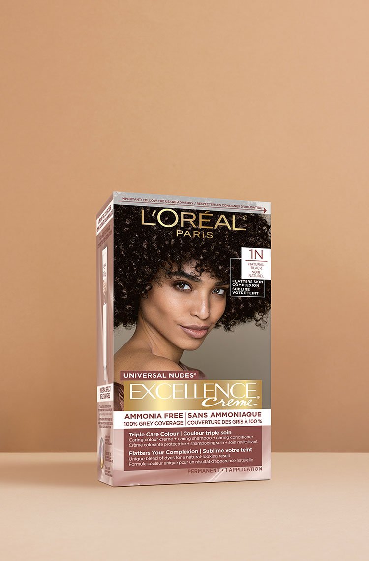 L'Oréal Excellence Crème Universal Nudes 1N Very Dark Black hair dye box, displaying a smiling woman with very dark, voluminous curly black hair.