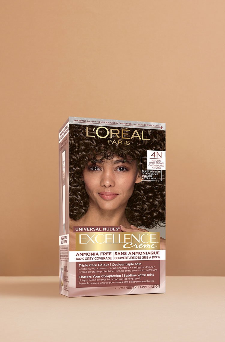 L'Oréal Excellence Crème Universal Nudes 4N Dark Brown hair dye box, displaying a smiling woman with voluminous dark brown curly hair.