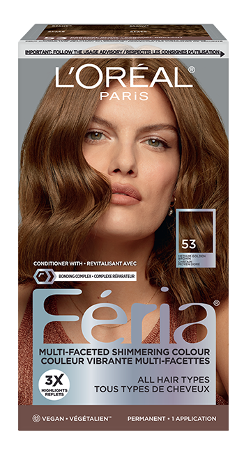 Boîte de teinture capillaire L'Oréal Paris Féria 'Multi-Faceted Shimmering Colour' (Couleur Vibrante Multi-Facettes) en teinte 53 Medium Golden Brown / Moyen Blond Doré. La boîte présente une femme aux cheveux ondulés et brillants, d'un brun doré moyen, et un swatch carré de la couleur finale avec le numéro '53' et la mention 'MEDIUM GOLDEN BROWN / MOYEN BLOND DORÉ'. Le texte promotionnel inclut 'CONDITIONER WITH + REVITALISANT AVEC BONDING COMPLEX + COMPLEXE RÉPARATEUR', '3X HIGHLIGHTS REFLETS', 'ALL HAIR TYPES TOUS TYPES DE CHEVEUX', 'VEGAN • VÉGÉTALIEN', et 'PERMANENT • 1 APPLICATION'. En haut, un bandeau rappelle de 'IMPORTANT: FOLLOW THE USAGE ADVISORY / RESPECTER LES CONSIGNES D'UTILISATION