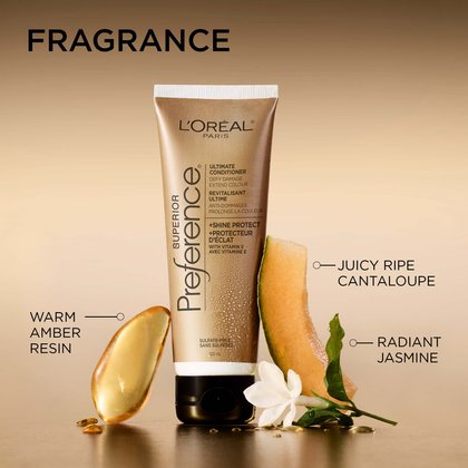 A decorative shot of the Superior Preference tube standing among fragrance elements: a piece of warm amber resin, a slice of juicy ripe cantaloupe, and a radiant white jasmine flower. The background is a soft gold.