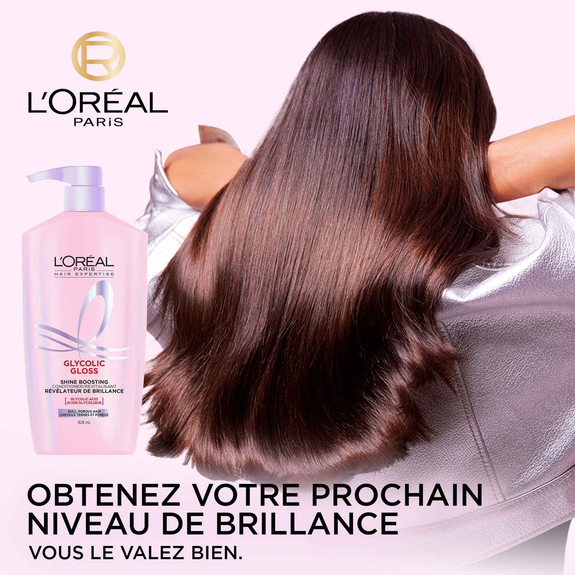 Une image isolée de la grande bouteille de l'après-shampooing révélateur de brillance L'Oréal Paris Glycolic Gloss avec une pompe, étiquetée pour les "Cheveux Terni et Poreux" et indiquant l'Acide Glycolique.