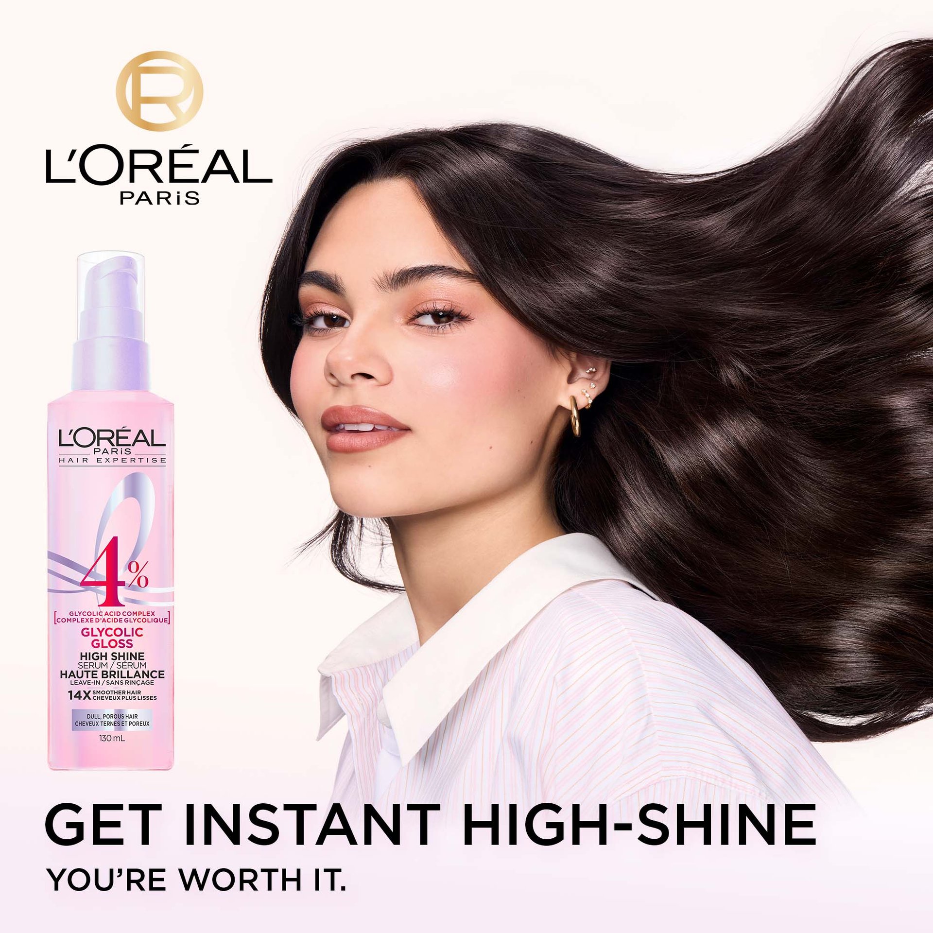 A L'Oréal Paris Glycolic Gloss High Shine Serum bottle stands next to a model from behind, showcasing her long, dark, incredibly shiny, and smooth hair. The text "GET NEXT-LEVEL SHINE YOU'RE WORTH IT." is visible at the bottom.
