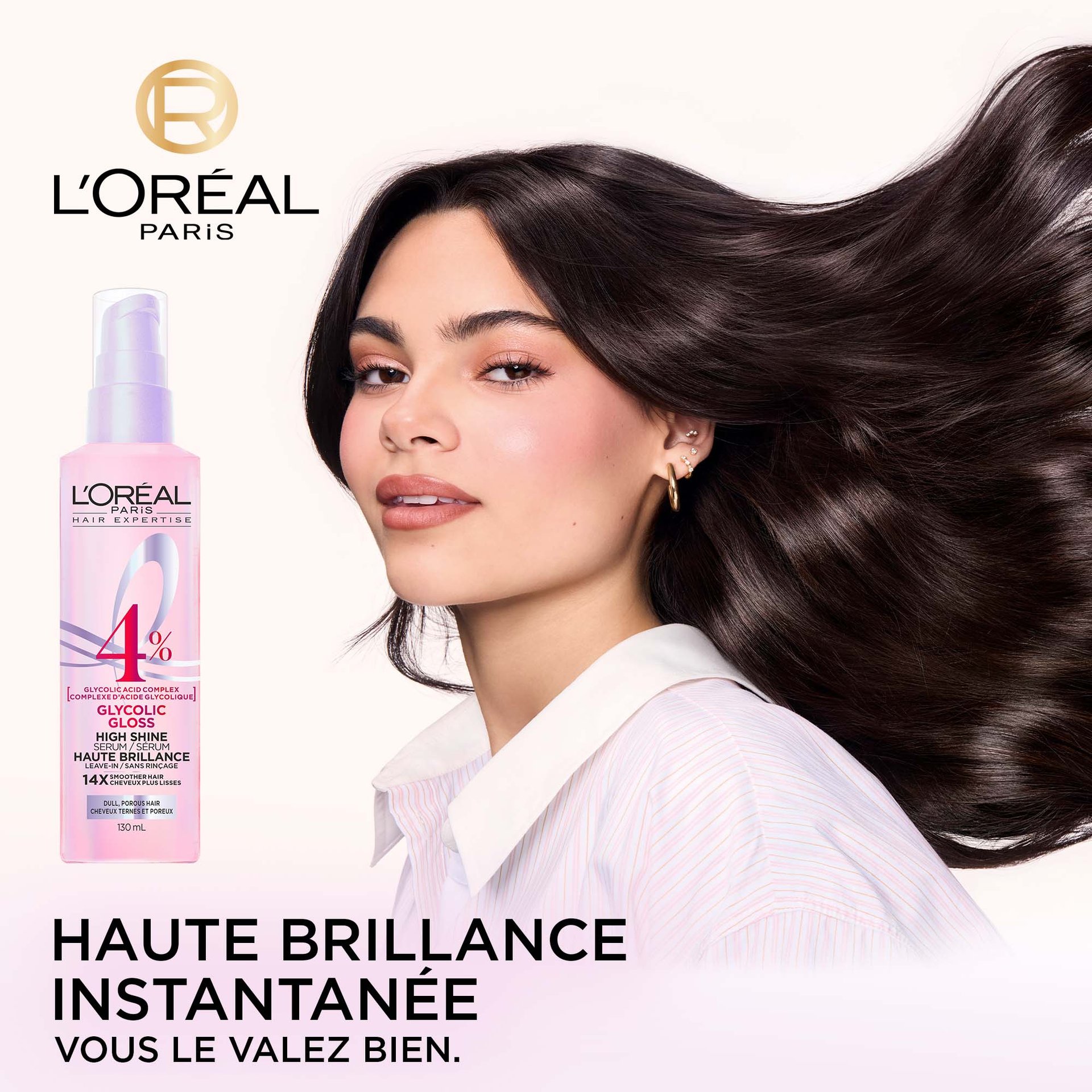 Une bouteille de sérum brillance L'Oréal Paris Glycolic Gloss est placée à côté d'un modèle vu de dos, mettant en valeur ses longs cheveux foncés, incroyablement brillants et lisses. Le texte "GET NEXT-LEVEL SHINE YOU'RE WORTH IT." est visible en bas de l'image.