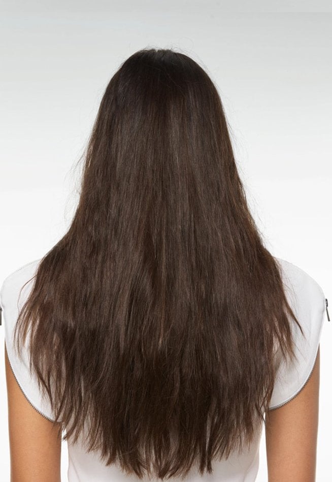  Back view of a person with long, dull, and slightly unkempt dark brown hair, against a white background.