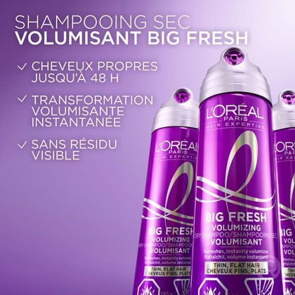 Deux flacons violets de shampooing sec volumisant Big Fresh Hair Expertise de L'Oréal Paris. Des coches blanches mettent en évidence trois bénéfices du produit : « Purifie les cheveux jusqu'à 48 h », « Transformation instantanée du volume » et « Sans résidu visible ».