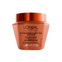 Un plan de studio du pot orange de L'Oréal Paris Hair Expertise Extraordinary Oil Masque Nourrissant à l’Huile de Jojoba sur fond blanc, muni d'un couvercle orange foncé brillant.