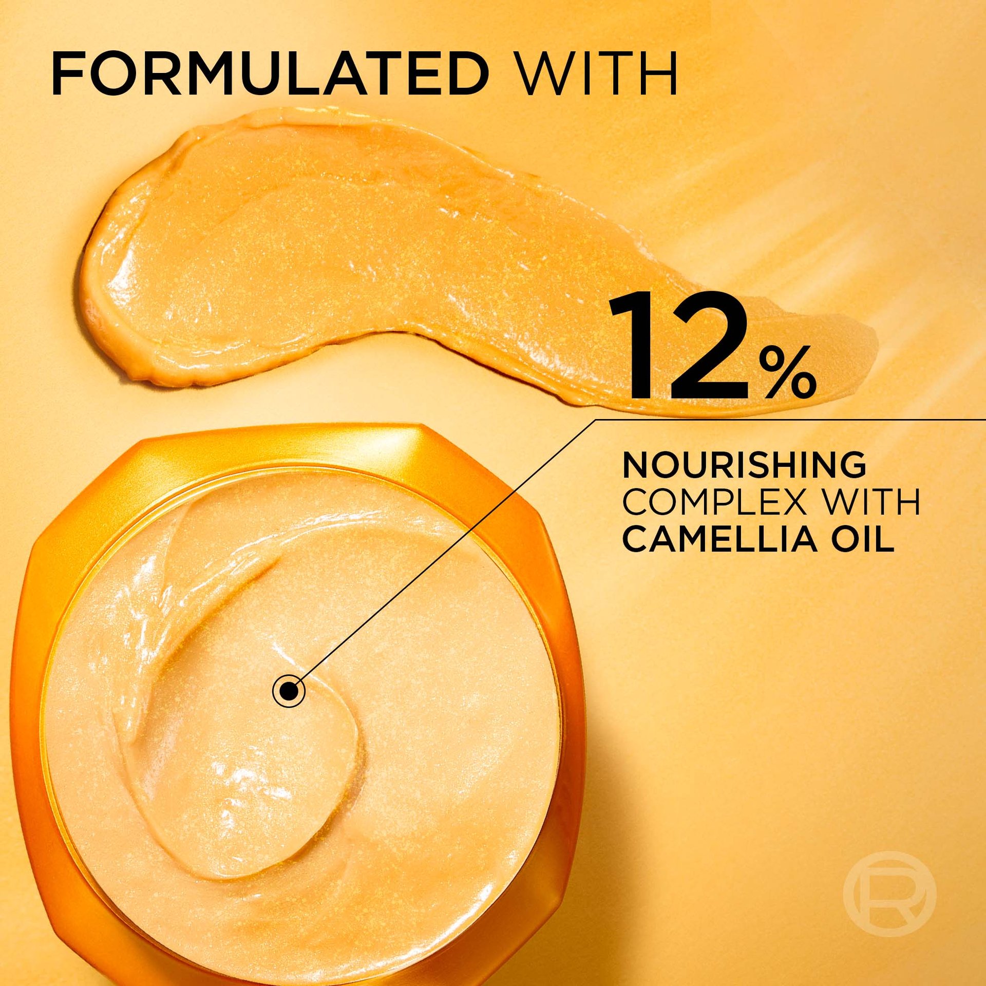 Close-up of the open gold jar of L'Oréal Paris Extraordinary Oil mask revealing smooth yellow cream inside. Text reads: "Formulated with 12% nourishing complex with [camellia oil]".