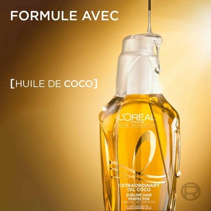 Le flacon doré de L'Oréal Paris Huile Extraordinaire sous une lumière chaude, avec une goutte d'huile capillaire claire qui coule par-dessus. À gauche, le texte indique « Formule enrichie d'huile de coco ».