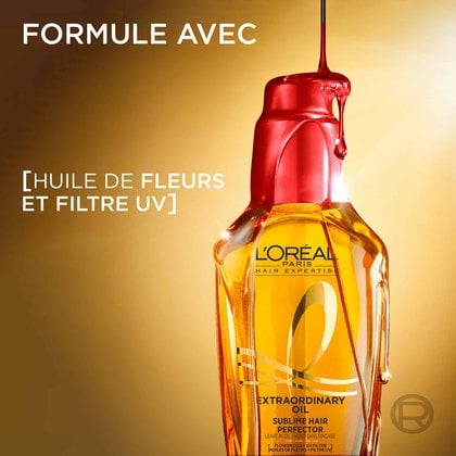Le flacon doré de L'Oréal Paris Huile Extraordinaire avec une goutte d'huile capillaire claire qui coule par-dessus. À gauche, le texte indique « Formule enrichie d'huiles de fleurs et filtre UV ».