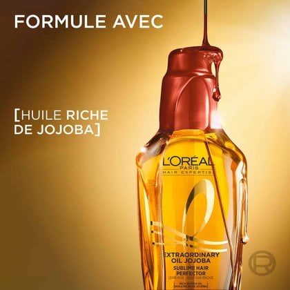 Le flacon doré de L'Oréal Paris Huile Extraordinaire Jojoba avec une de goutte d'huile claire qui coule par-dessus. À gauche, le texte indique « Formule enrichie d'huile riche de jojoba ».