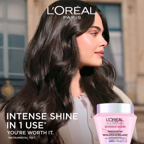 A side-profile view of a woman with long, smooth, and extremely shiny dark hair. To her left, the text reads "Intense shine in 1 use", with the pink hair mask jar in the bottom corner.