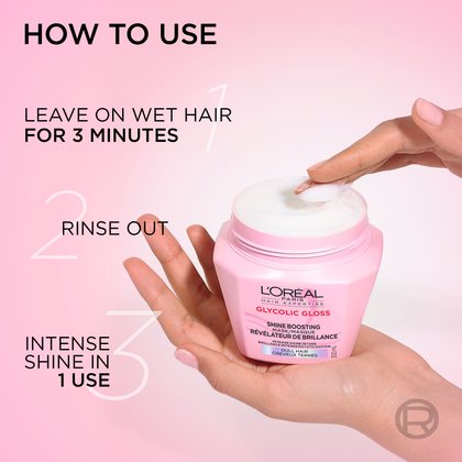 Hands holding the pink hair mask jar and taking a scoop of white cream. On the left, step-by-step instructions read: "How to use: Leave on wet hair for 3 minutes, rinse out, intense shine in 1 use".