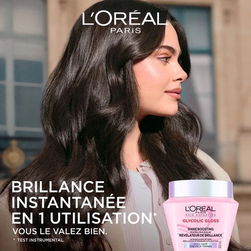 Profil d'une femme aux cheveux longs noirs, lisses et extrêmement brillants. À sa gauche, le texte indique « Brillance intense dès la 1ère utilisation » avec le pot de masque rose en bas.