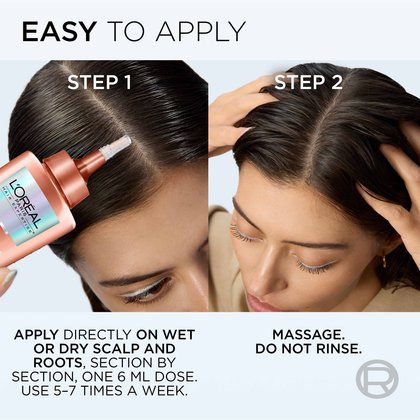 A woman who easily applies the density booster serum to the center of her hair.