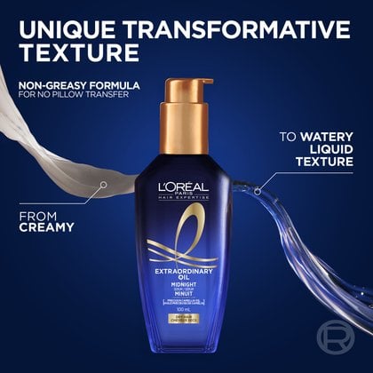 The blue L'Oréal Paris Midnight Hair Serum bottle on a dark blue background showing the product's unique transformative texture. A dollop of white cream on the left transitions into a watery liquid texture on the right.