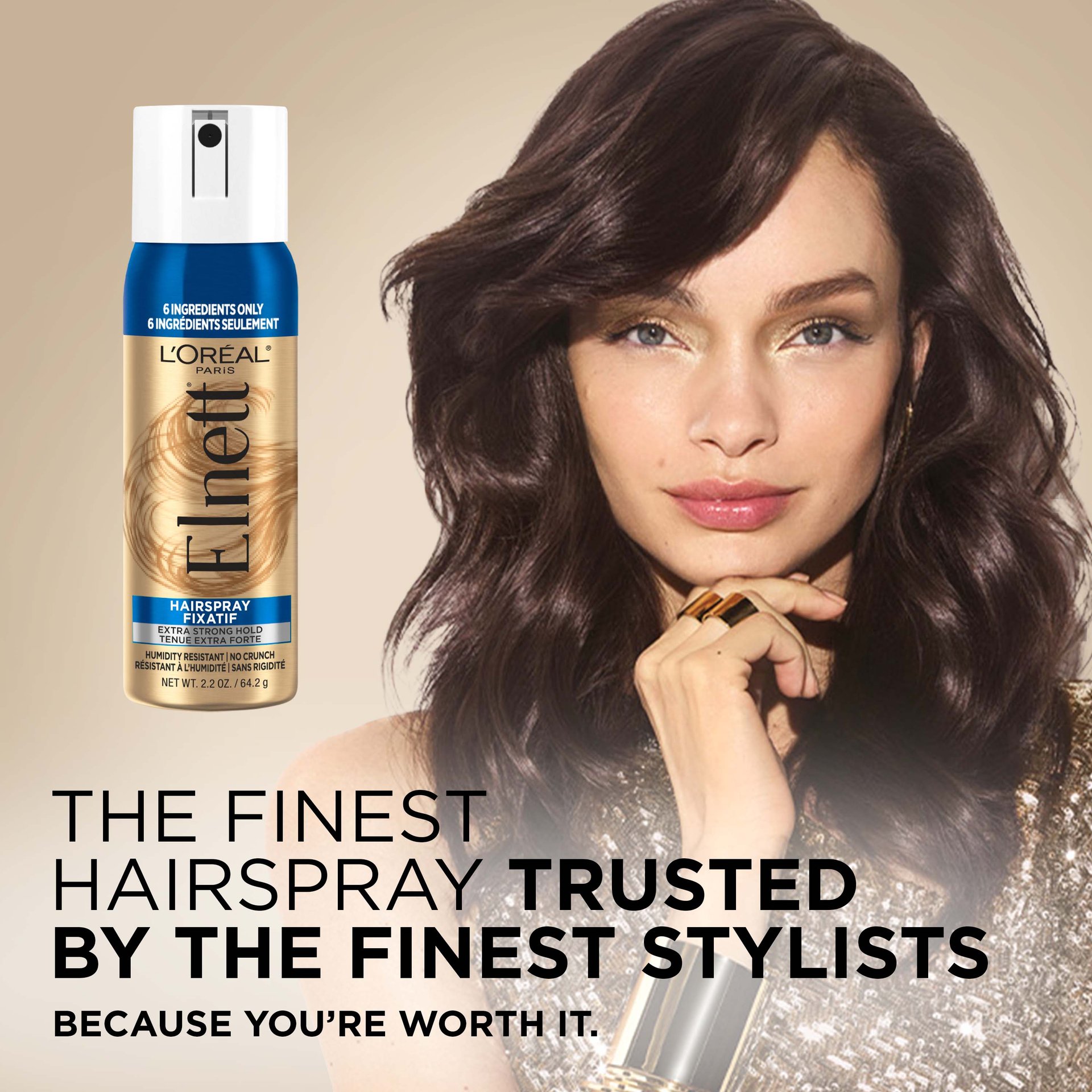 A women with a blowout and a Elnett hair spray 