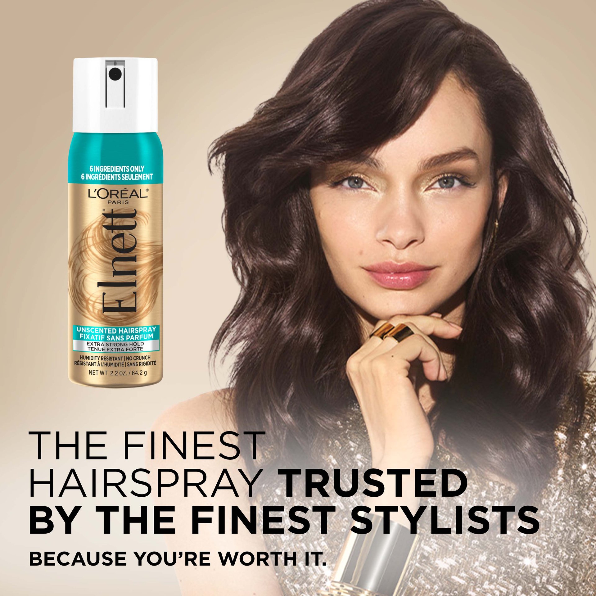 A women with a blowout and a Elnett hair spray 