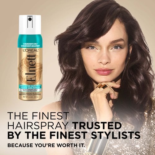 A women with a blowout and a Elnett hair spray