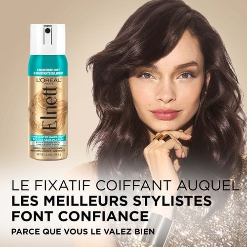 Une femme avec un brushing qui tient et une laque elnett