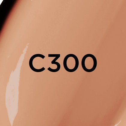 Un gros plan d'un fond de teint ou d'une texture crémeuse de couleur beige foncé à moyen, avec le texte noir en gras 'C300' centré sur l'image, indiquant probablement une teinte de produit.