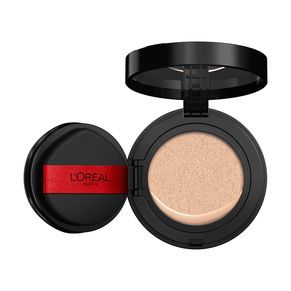 An open L'Oréal cushion foundation compact, black with a red L'Oréal Paris logo on the puff, revealing a light beige foundation in the cushion