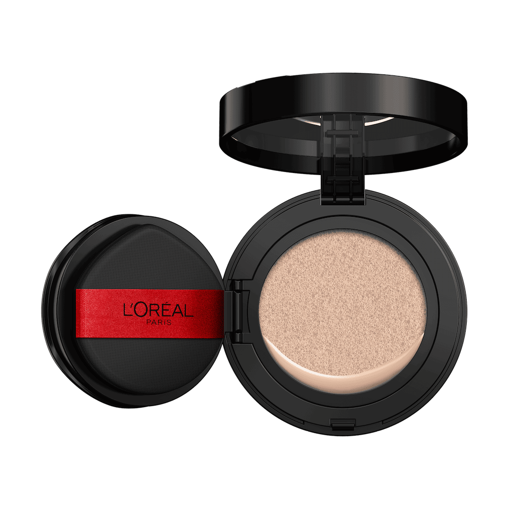 An open L'Oréal cushion foundation compact, black with a red L'Oréal Paris logo on the puff, revealing a light beige foundation in the cushion