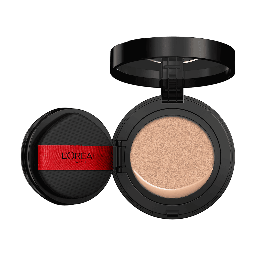 An open L'Oréal cushion foundation compact, black with a red L'Oréal Paris logo on the puff, revealing a light beige foundation in the cushion