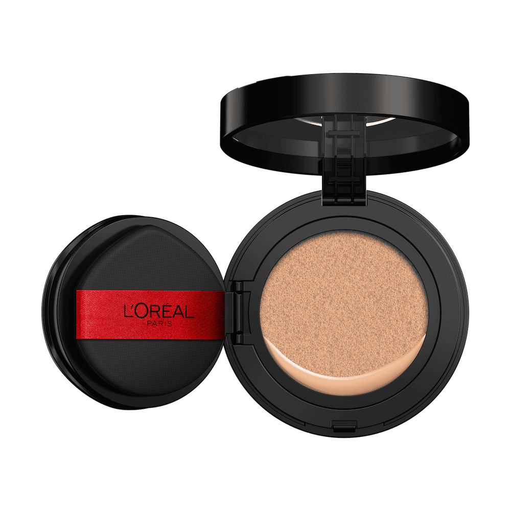 An open L'Oréal cushion foundation compact, black with a red L'Oréal Paris logo on the puff, revealing a light beige foundation in the cushion