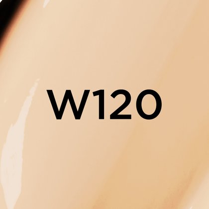 Un gros plan d'un fond de teint ou d'une texture crémeuse de couleur beige clair, avec le texte noir en gras 'W120' centré sur l'image, indiquant probablement une teinte de produit
