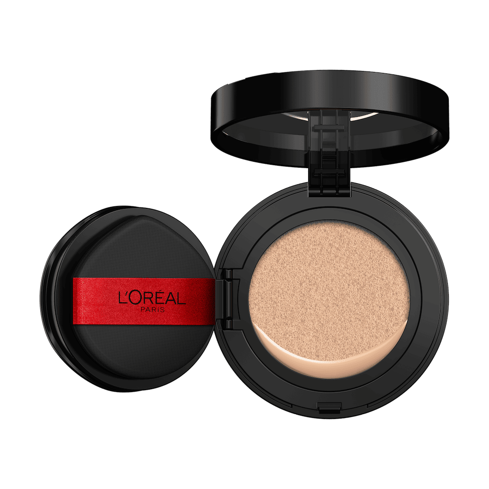An open L'Oréal cushion foundation compact, black with a red L'Oréal Paris logo on the puff, revealing a light beige foundation in the cushion