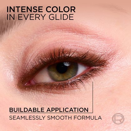 A close-up of an eye being defined by the bronze eyeliner pencil with the headline "Intense Color in Every Glide," emphasizing the seamless, buildable application.