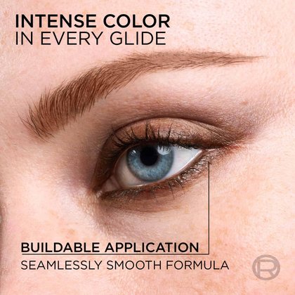 A close-up of an eye being defined by the brown eyeliner pencil with the headline "Intense Color in Every Glide," emphasizing the seamless application.