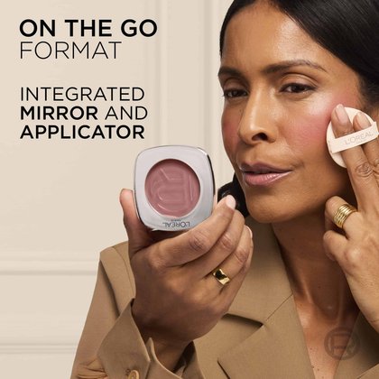 A woman holding the compact open to show the built-in mirror and applying the product with the puff applicator, labeled "ON THE GO FORMAT INTEGRATED MIRROR AND APPLICATOR".