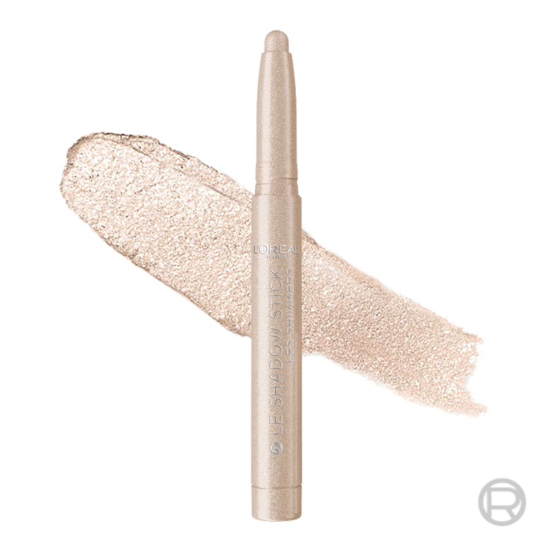 Professional product shot of a light champagne L'Oréal Shadow Stick in 'Nude Lights' standing next to a creamy, shimmery swatch.