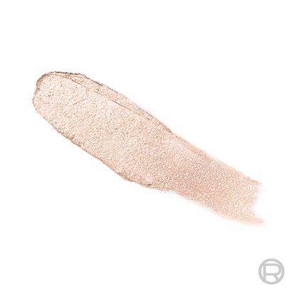 An e-commerce texture shot of a thick, shimmery champagne-nude pigment swatch against a plain white background.