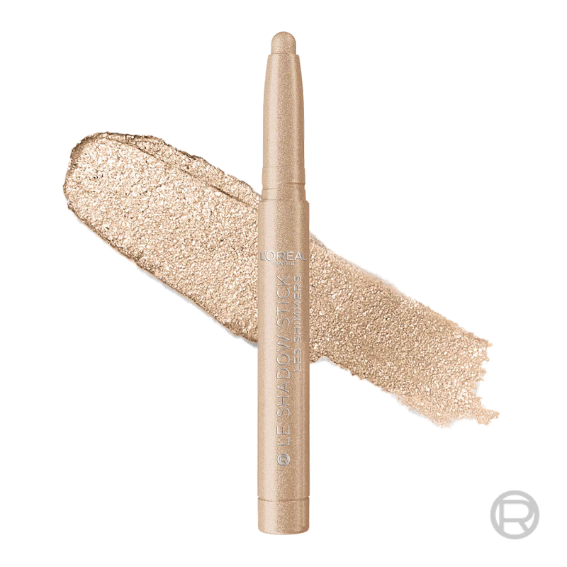 Professional product packshot of the L'Oréal Shadow Stick in 'Peach Lights' standing upright next to a shimmery, peach-toned cream swatch.