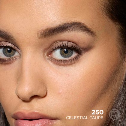 A beauty shot close-up of a model's face showcasing a refined shimmering taupe smokey eye makeup look, labeled '250 Celestial Taupe'.