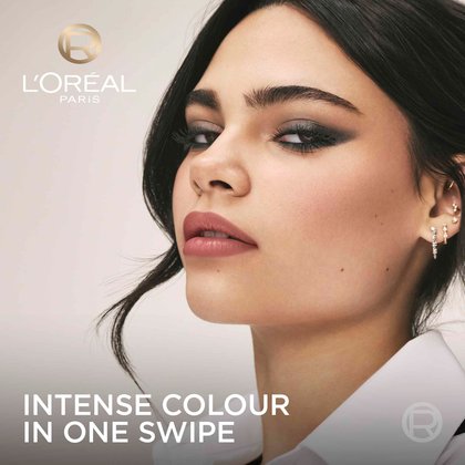 A portrait of a model with a shimmering taupe smokey eye look, captioned with 'Intense colour in one swipe'.