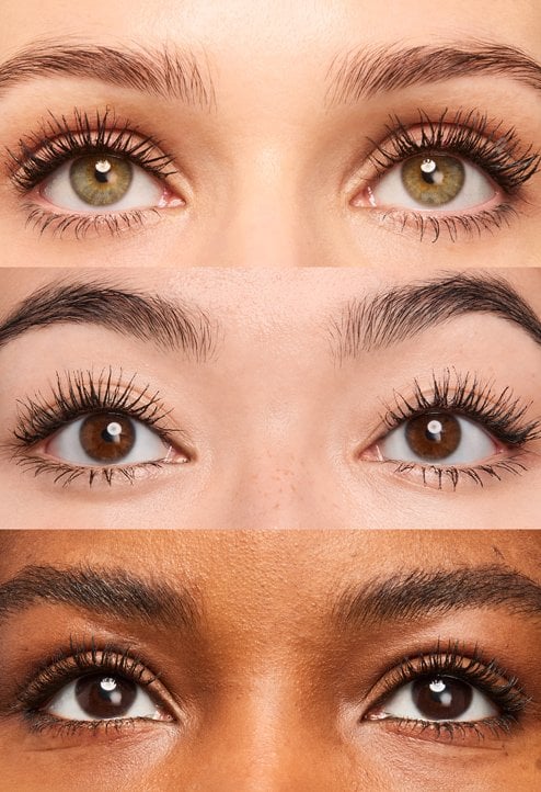 Advertising montage featuring three pairs of eyes of different skin tones in the center, showcasing long and defined lashes using Telescopic Extensionist mascara. The visual is framed by artistic close-ups of the shiny silver chrome mascara tube.