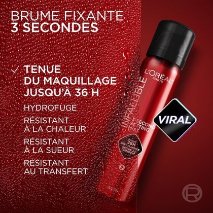 Un flacon rouge de "L'Oréal Infallible 3-Second Setting Mist" est positionné en diagonale sur une surface texturée rouge foncé couverte de gouttelettes d'eau. Des textes superposés déclarent "BRUME FIXATRICE 3 SECONDES", "TENUE DU MAQUILLAGE JUSQU'À 36H", avec les sous-points : "RÉSISTANT À L'EAU", "RÉSISTANT À LA CHALEUR", "RÉSISTANT À LA TRANSPIRATION", "ANTI-TRANSFERT". Un badge noir et rose "VIRAL" est affiché à droite du flacon.