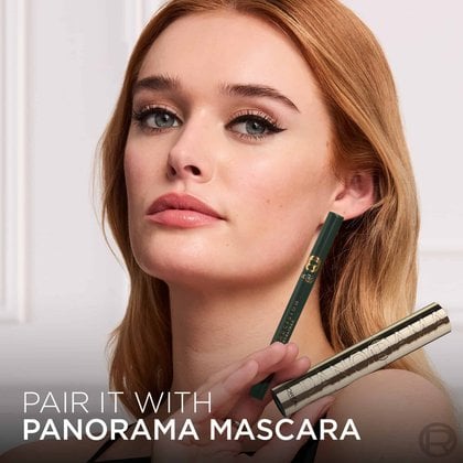 A model with vibrant green winged eyeliner looks directly at the camera, holding the dark green L'Oréal Paris Haute Precision Liquid Eyeliner. The L'Oréal Paris logo is in the top left corner, and the text "CHROMATIC LOOK WITH HAUTE PRECISION LIQUID EYELINER YOU'RE WORTH IT." is at the bottom