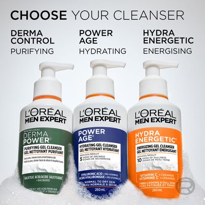 Three L'Oréal Men Expert cleansers sit side-by-side in white foam: Derma Power (Green, Purifying), Power Age (Blue, Hydrating), and Hydra Energetic (Orange, Energizing). Text above reads "CHOOSE YOUR CLEANSER."