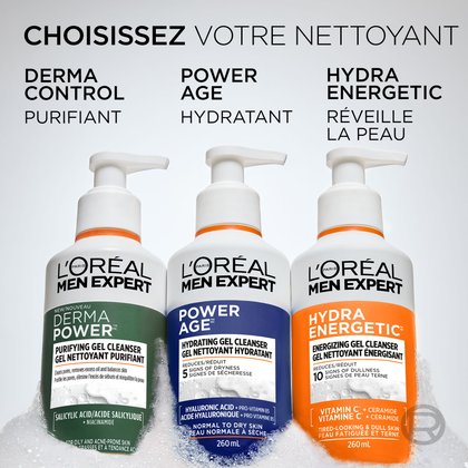 Trois nettoyants L'Oréal Men Expert sont côte à côte dans de la mousse blanche : Derma Power (vert, purifiant), Power Age (bleu, hydratant) et Hydra Energetic (orange, énergisant). Le texte ci-dessus indique : « CHOISISSEZ VOTRE NETTOYANT ».