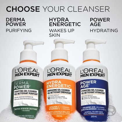 Three L'Oréal Men Expert cleansers arranged side-by-side in white foam: Derma Power (Green, Purifying), Hydra Energetic (Orange, Wakes Up Skin), and Power Age (Blue, Hydrating). Text above reads "CHOOSE YOUR CLEANSER."